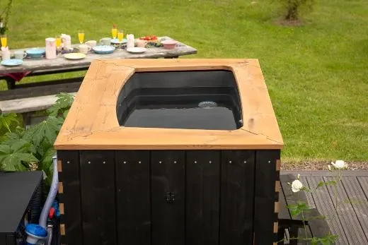 A compact, rectangular tub designed for solo soaking.