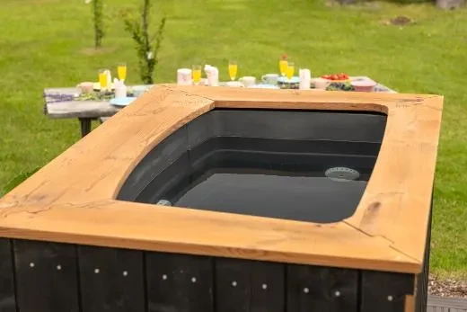 The elegantly contoured edges of the hot tub complete its overall appearance.